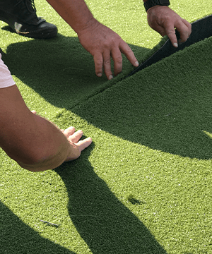 People installing a SYNLawn putting green