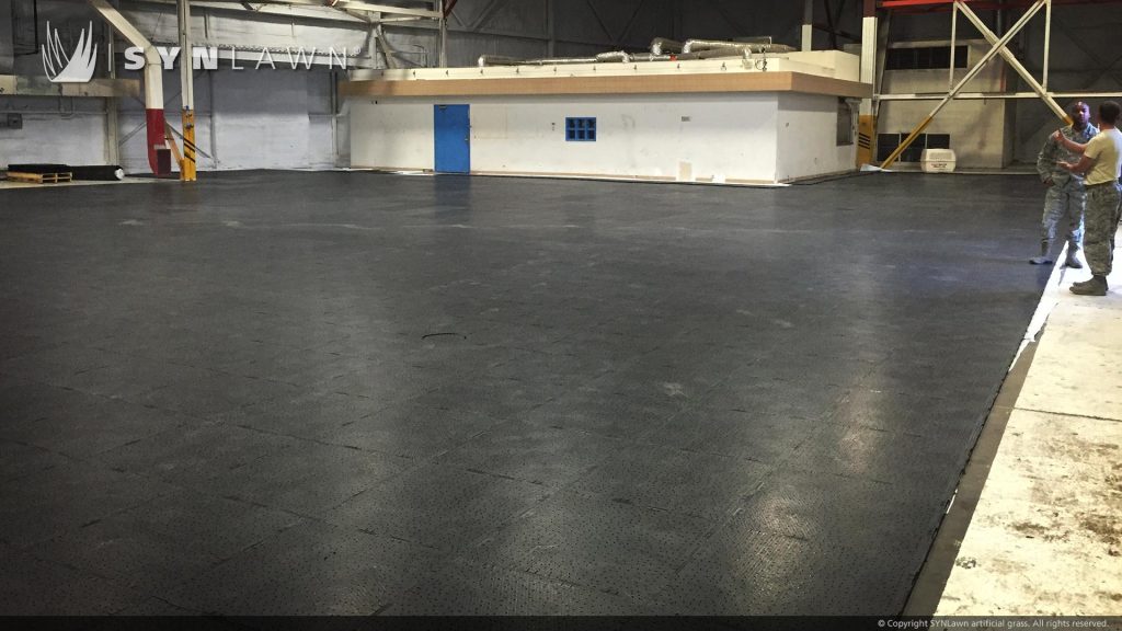 image of military hangar with artificial pet grass