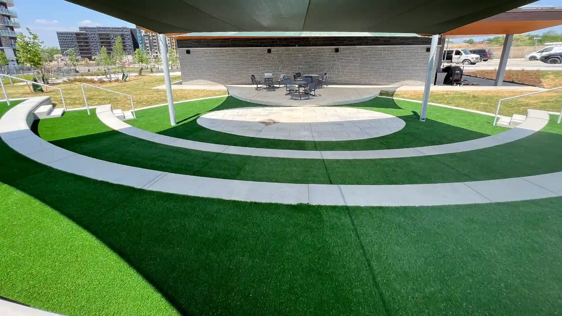 Solar-Powered Community Builds Outdoor Amphitheater Featuring Bio-Based Artificial Grass Landscaping