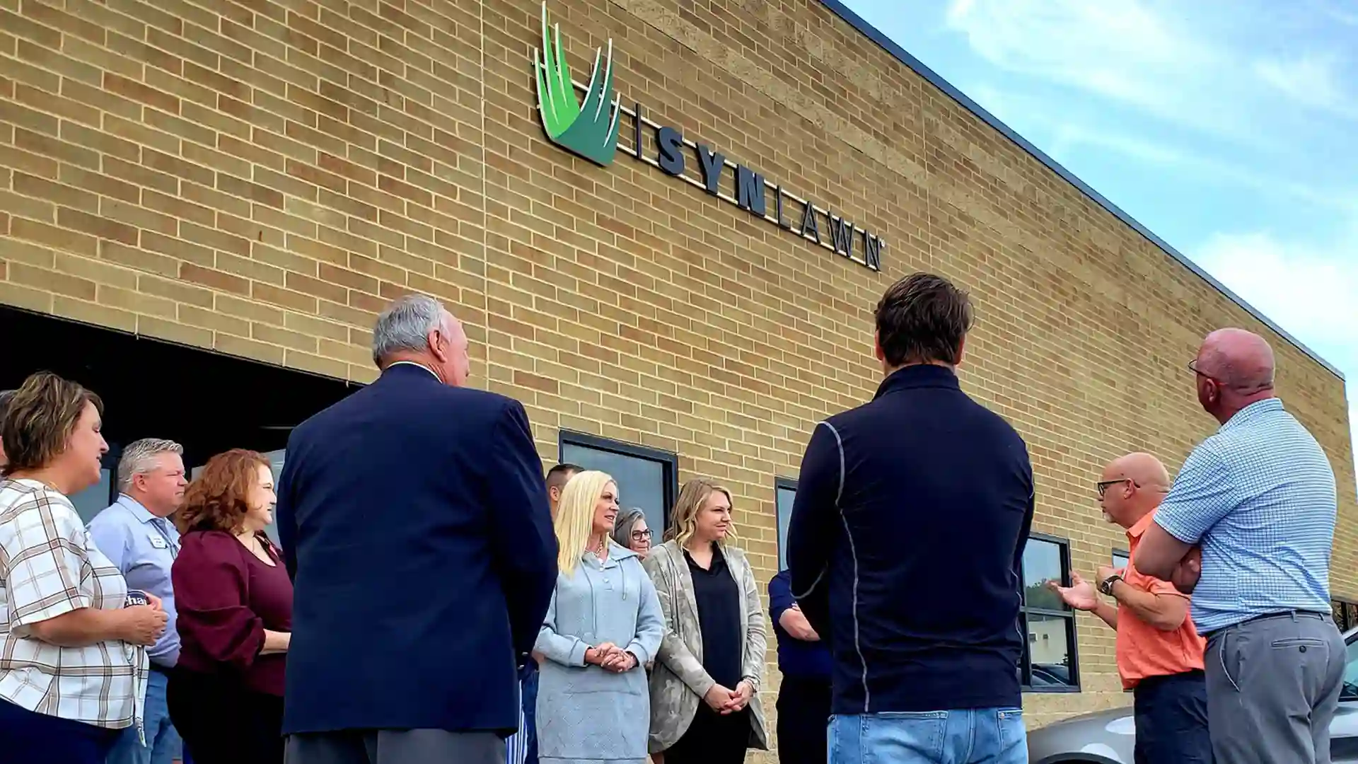 image of the grand opening ribbon cutting of the synlawn saint louis showroom