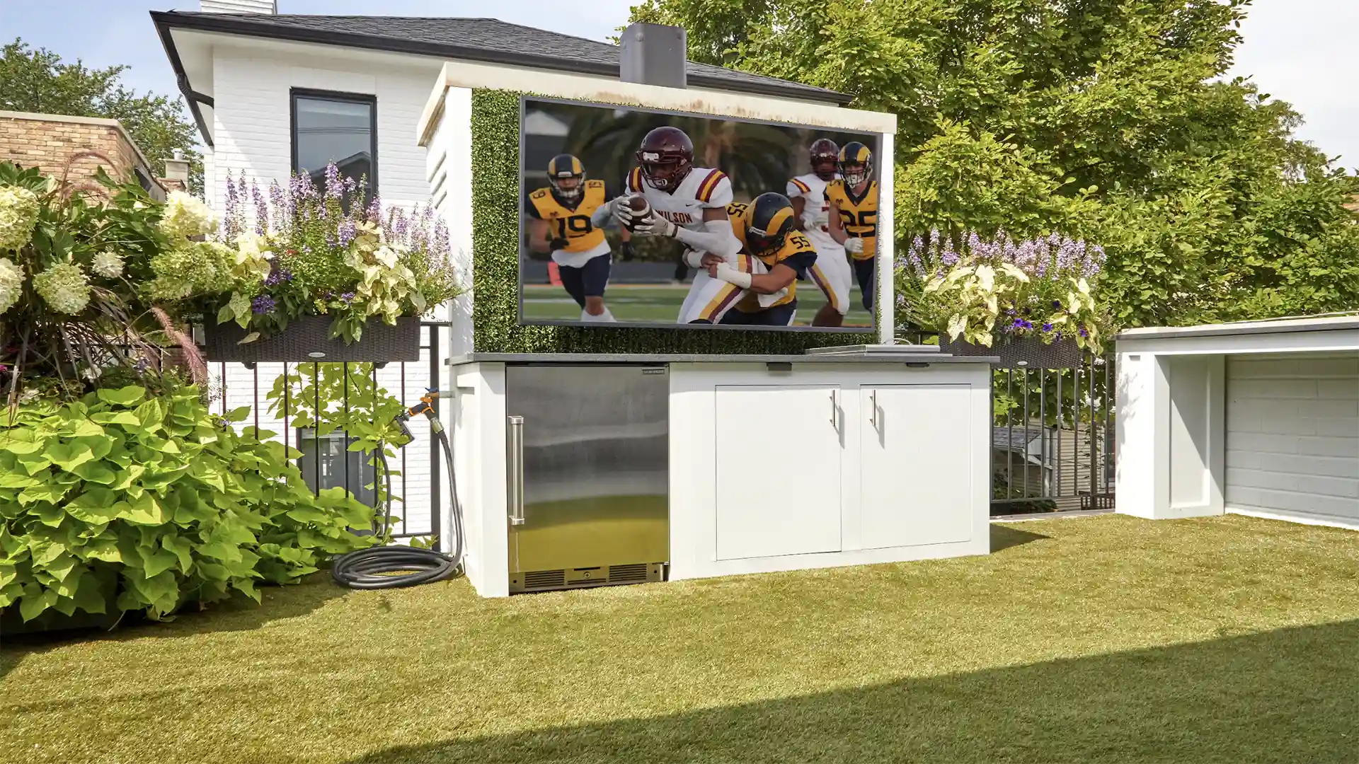 image of Sports themed rooftop installation of SYNLawn artificial grass with Calico Greens faux living wall panels at Roscoe Village neighborhood home in Chicago Illinois