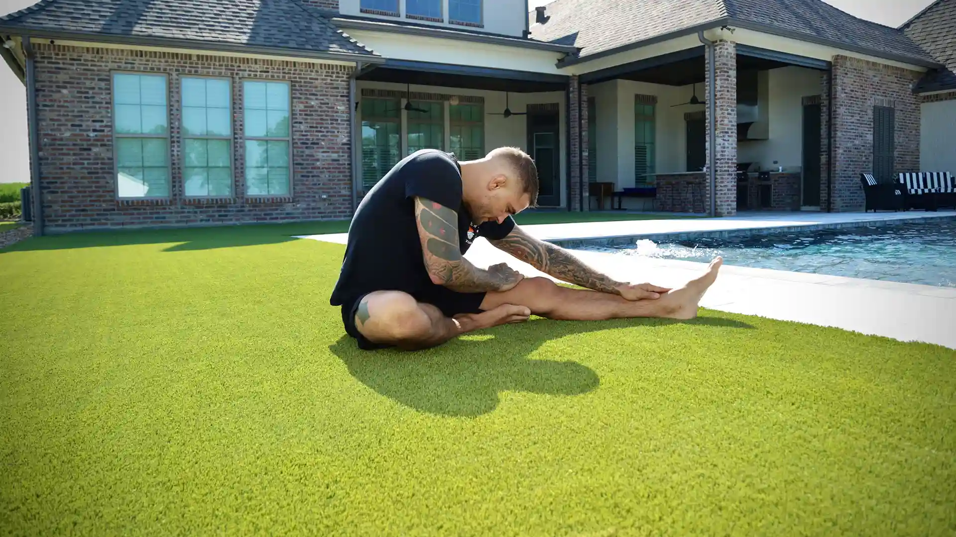 image of MMA Champion Dustin Poirier working out on artificial grass at his Louisiana home